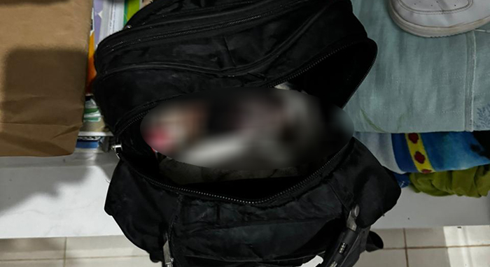Feto morto dentro de mochila
